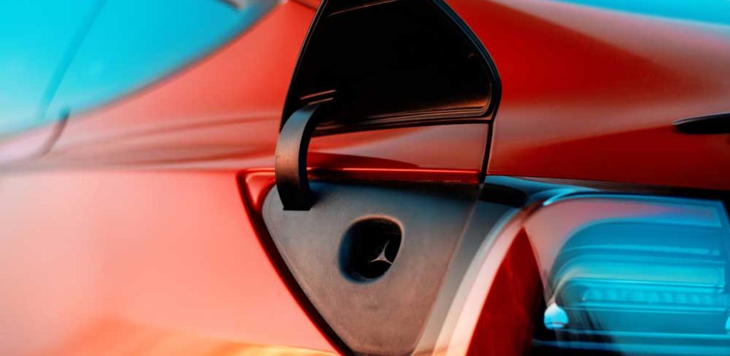 red-tesla-model-3-charging-port-2023-04-07-16-07-22-utc